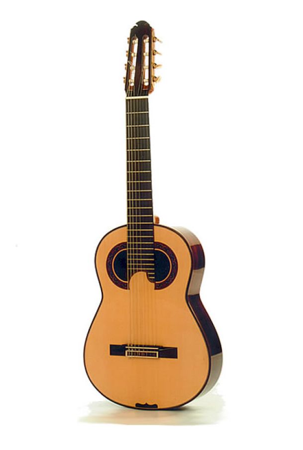 Concert 8 string guitar in the style of Francisco Simplicio | Soundboard: fine grained Spruce, taut bracing | Body: Brazilian Rosewood | Neck: Brazilian cedar | Machine heads: Engraved brass plates, mother of pearl buttons By David Rodgers